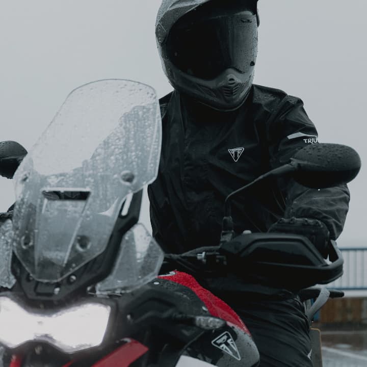 Model wearing triumph rain jacket